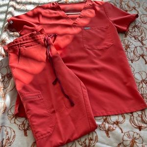 Rustic orange figs set. One pocket scrub top. Skinny tall yola pants